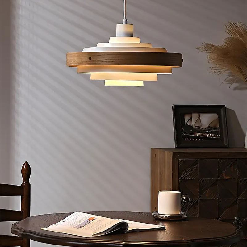 Modern pendant light over a dining table, wood and metal finish