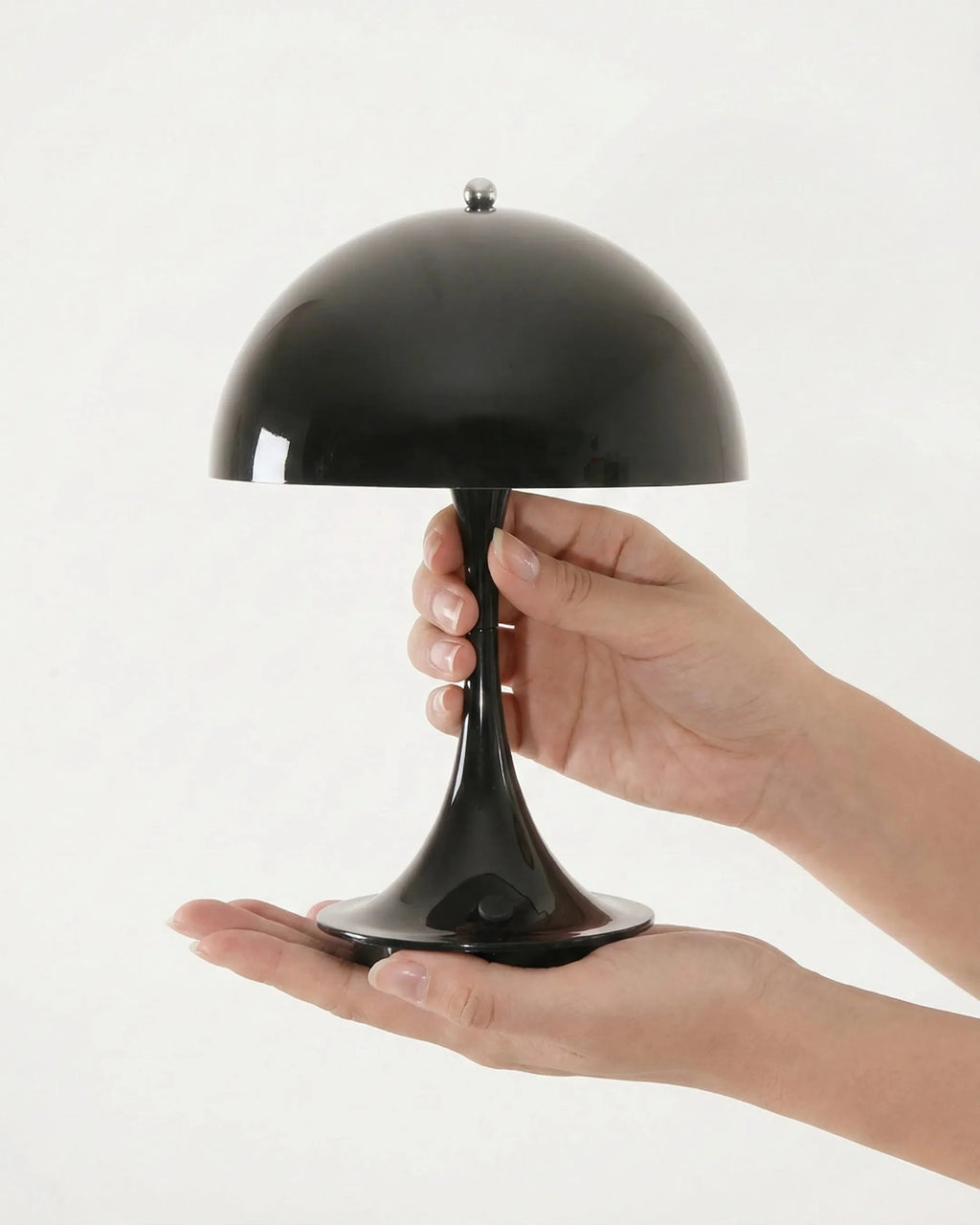 MIDO cordless designer table lamp casting warm ambient light over a coffee table — DecoHarmonie