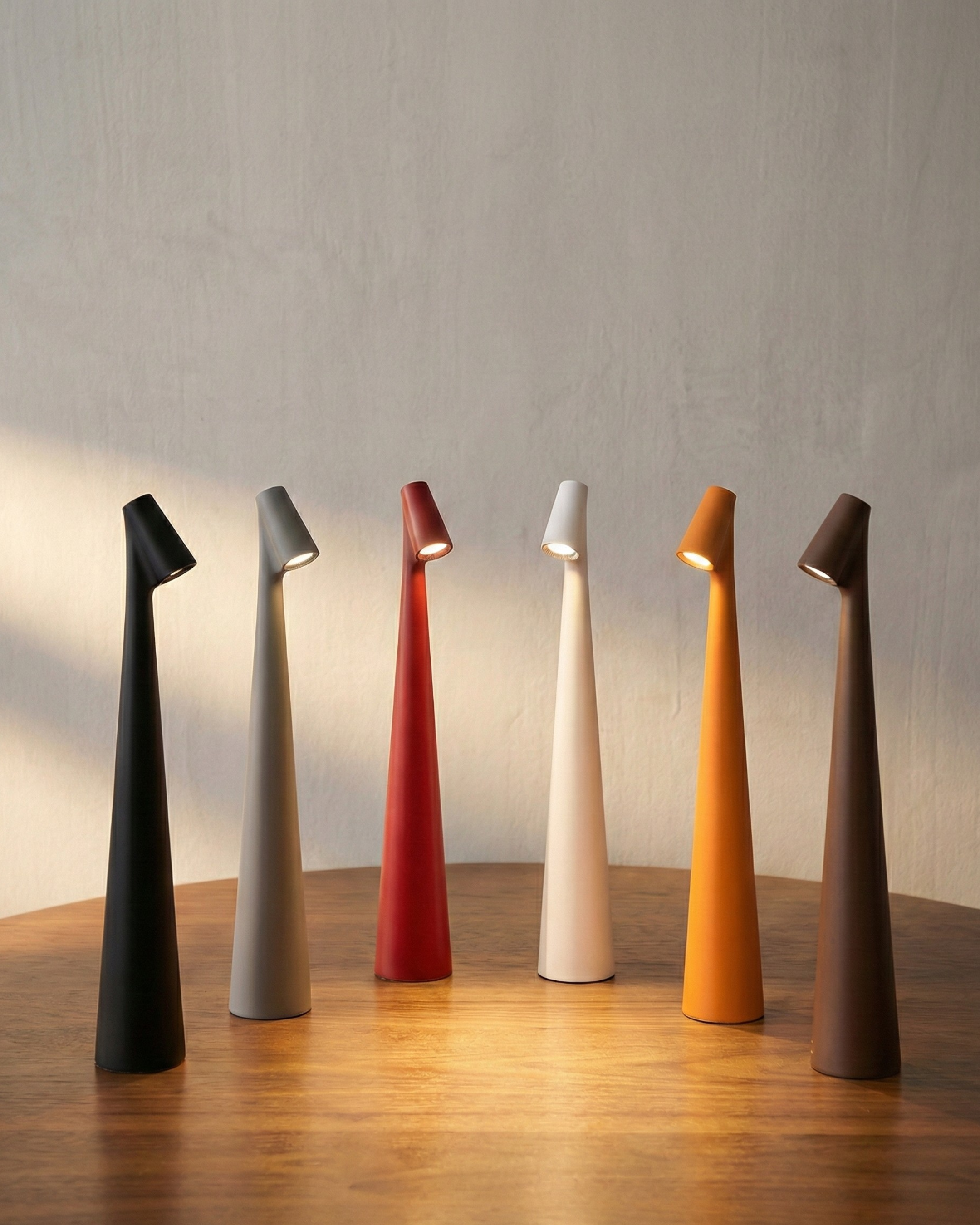 NORA cordless designer table lamp softening the light in a contemporary lounge — DecoHarmonie