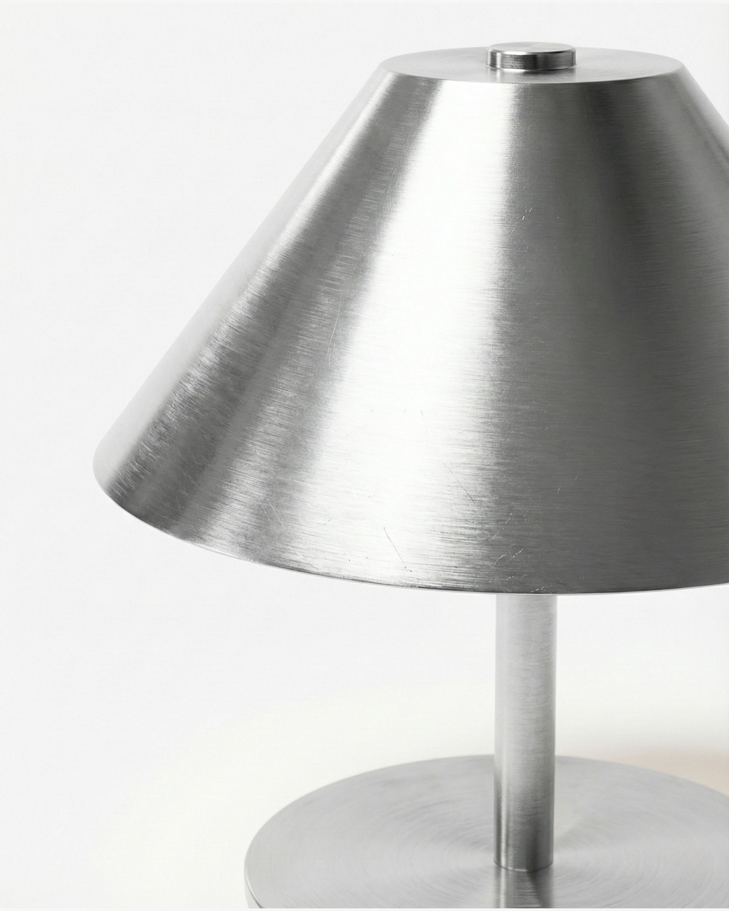 VARMA cordless designer table lamp casting warm ambient light over a coffee table — DecoHarmonie