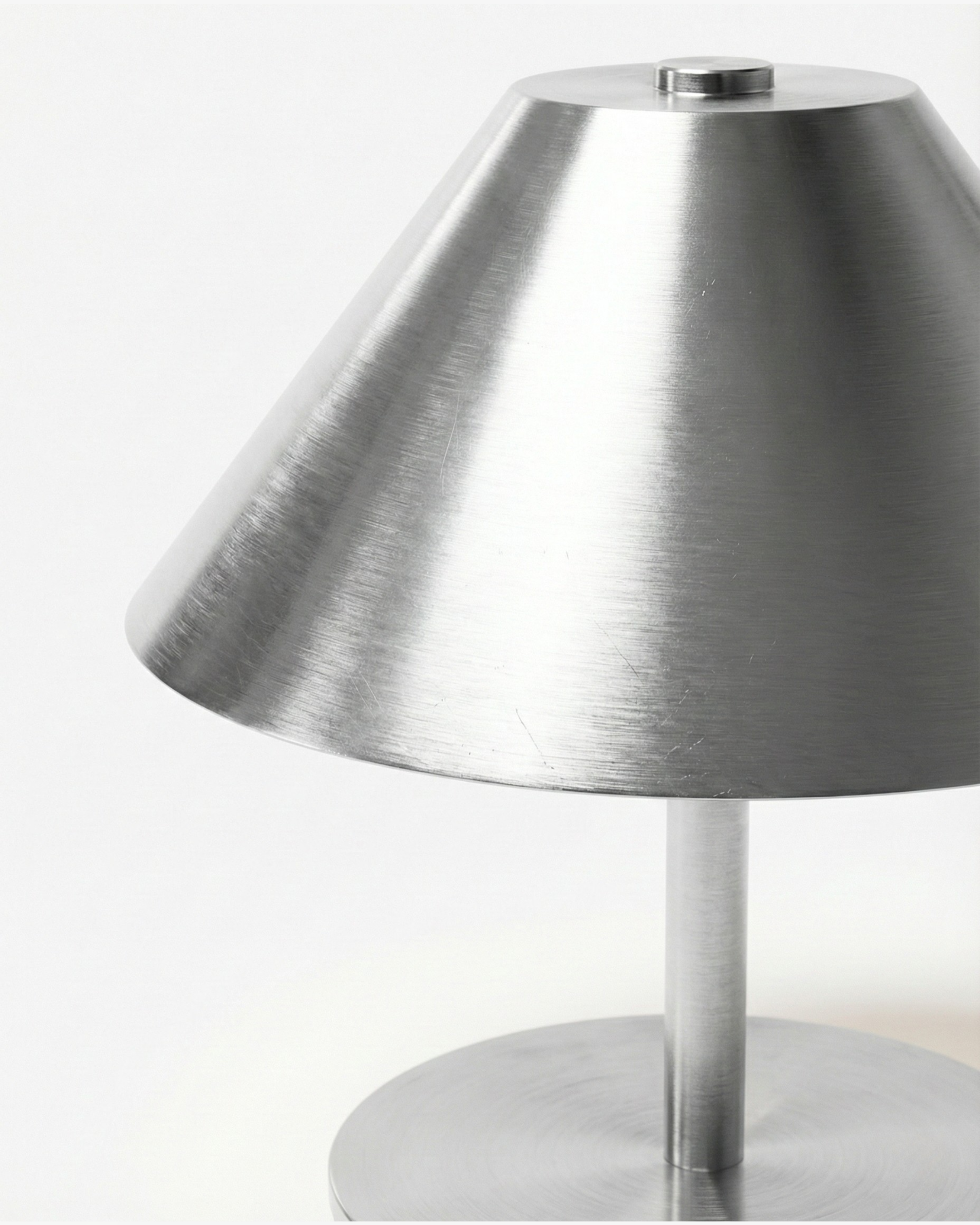 VARMA cordless designer table lamp casting warm ambient light over a coffee table — DecoHarmonie