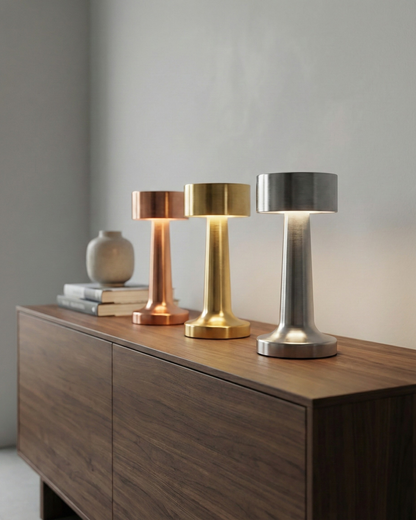 ELDA cordless designer table lamp casting warm ambient light over a coffee table — DecoHarmonie