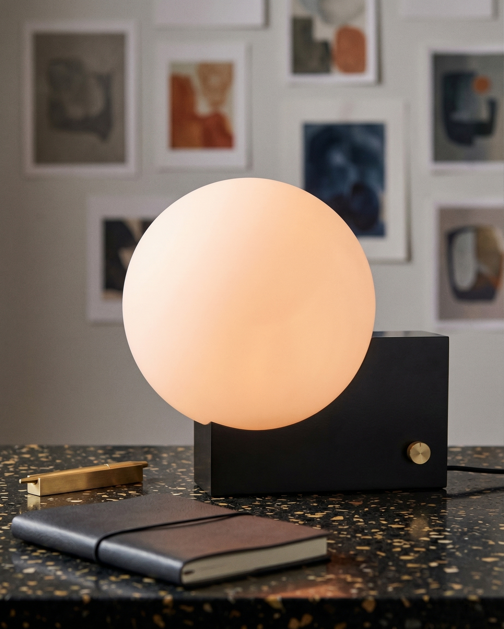 TERO designer table lamp softening the light in a contemporary lounge — DecoHarmonie