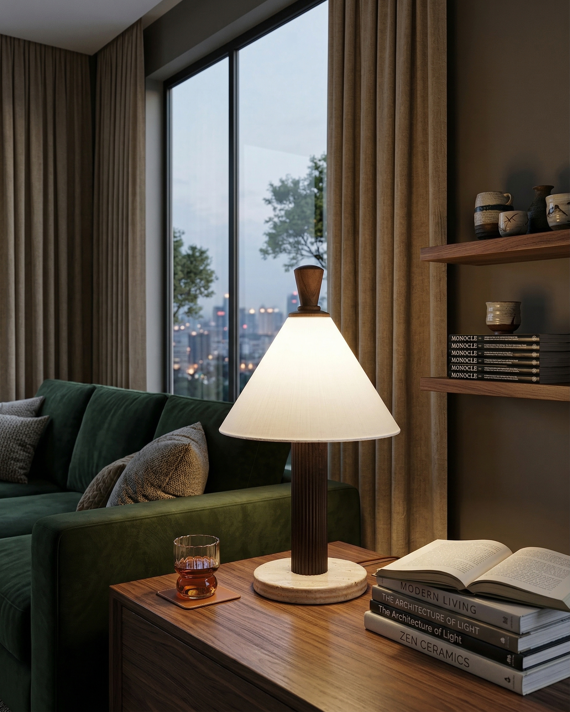 TÉA designer table lamp casting warm ambient light over a coffee table — DecoHarmonie