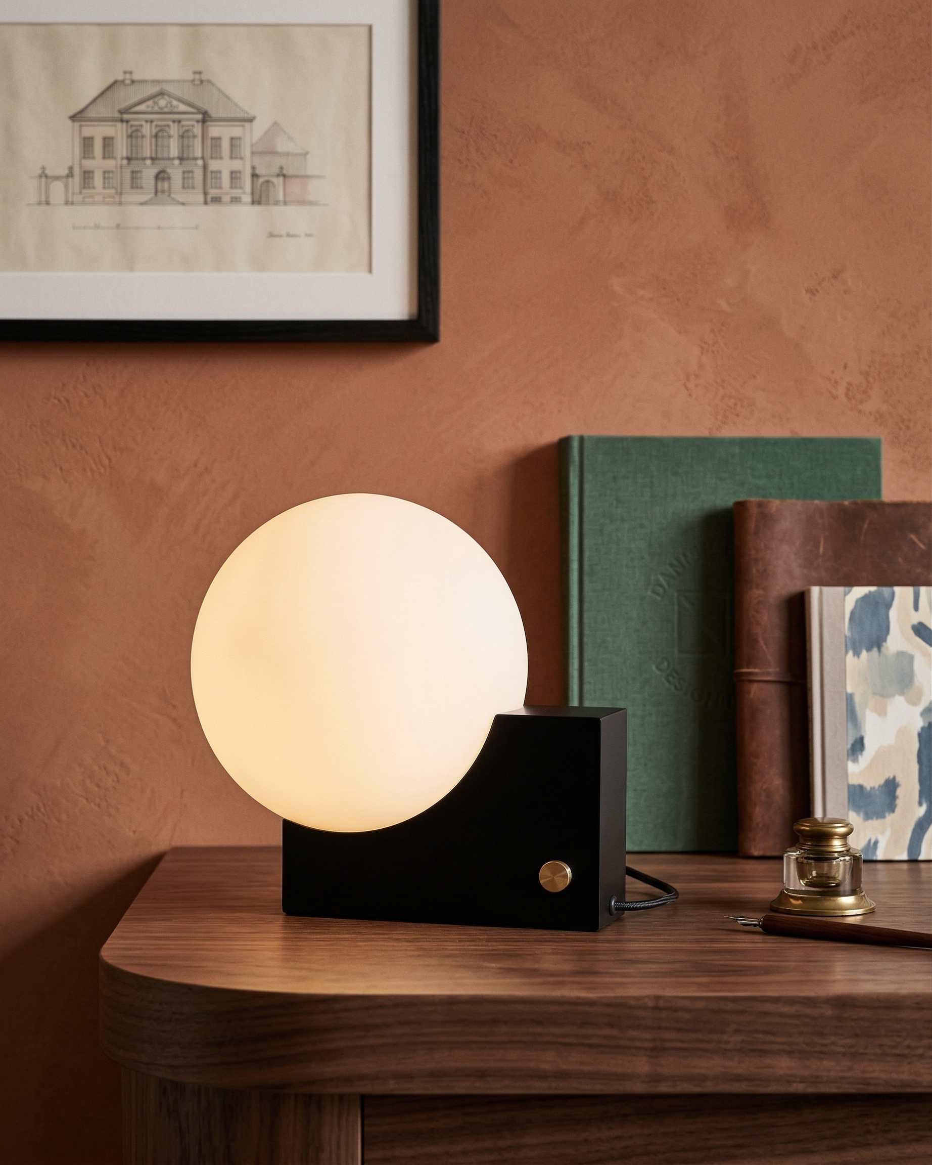 TERO designer table lamp shown on a bedside table in a modern bedroom — DecoHarmonie
