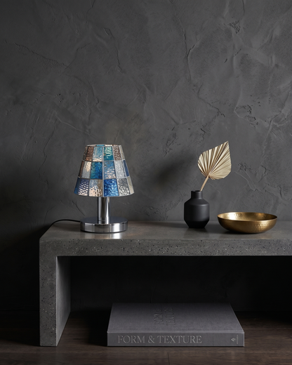 KALI designer table lamp shown on a bedside table in a modern bedroom — DecoHarmonie