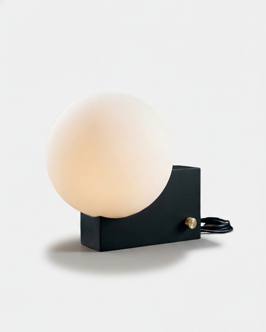TERO designer table lamp, frosted glass sphere on asymmetric matte black metal block base, Australian lighting | DecoHarmonie