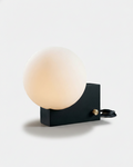 TERO designer table lamp, frosted glass sphere on asymmetric matte black metal block base, Australian lighting | DecoHarmonie