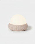 EON cordless table lamp with travertine pebble base and frosted glass half-dome, rechargeable | DecoHarmonie