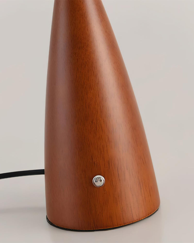 NALU designer table lamp casting warm ambient light over a coffee table — DecoHarmonie