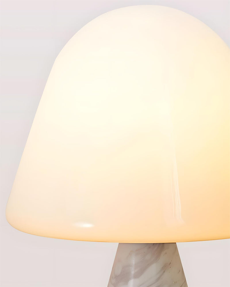 NOKA designer table lamp casting warm ambient light over a coffee table — DecoHarmonie