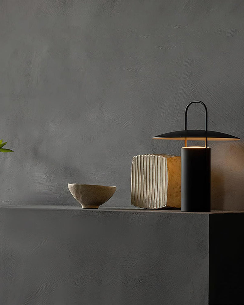 ORKA designer table lamp in a warm, considered living room setting — DecoHarmonie