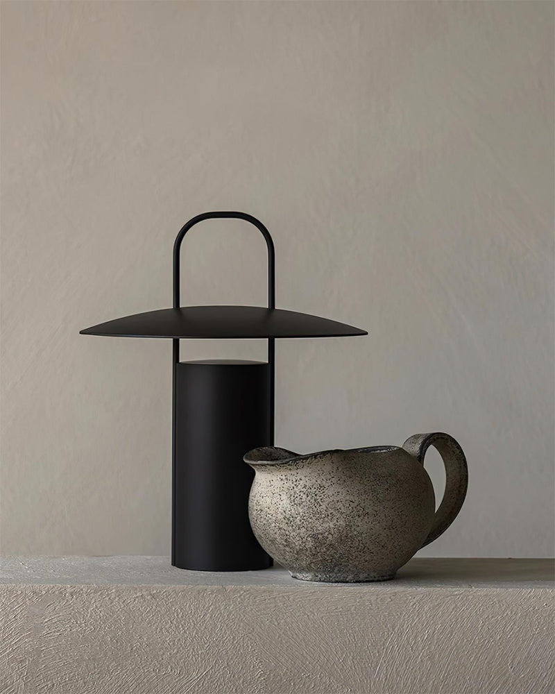ORKA designer table lamp softening the light in a contemporary lounge — DecoHarmonie