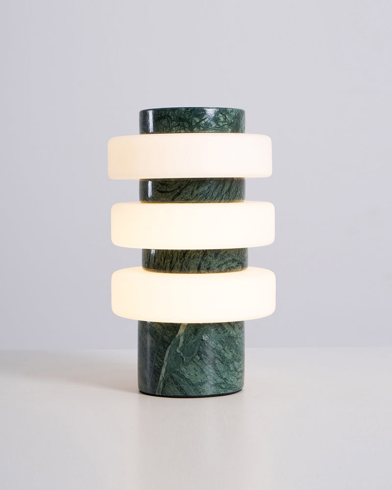 JALA designer table lamp casting warm ambient light over a coffee table — DecoHarmonie