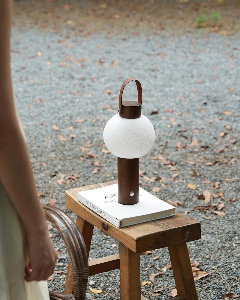 VENA designer table lamp in a warm, considered living room setting — DecoHarmonie