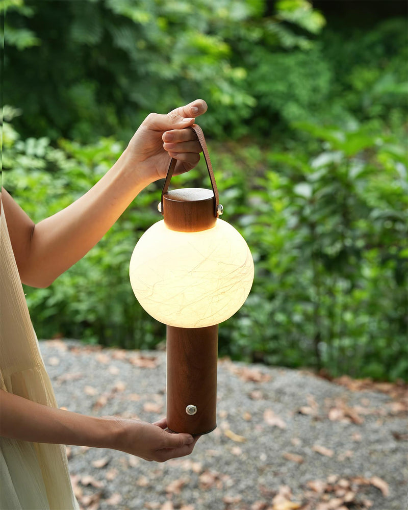 VENA designer table lamp casting warm ambient light over a coffee table — DecoHarmonie