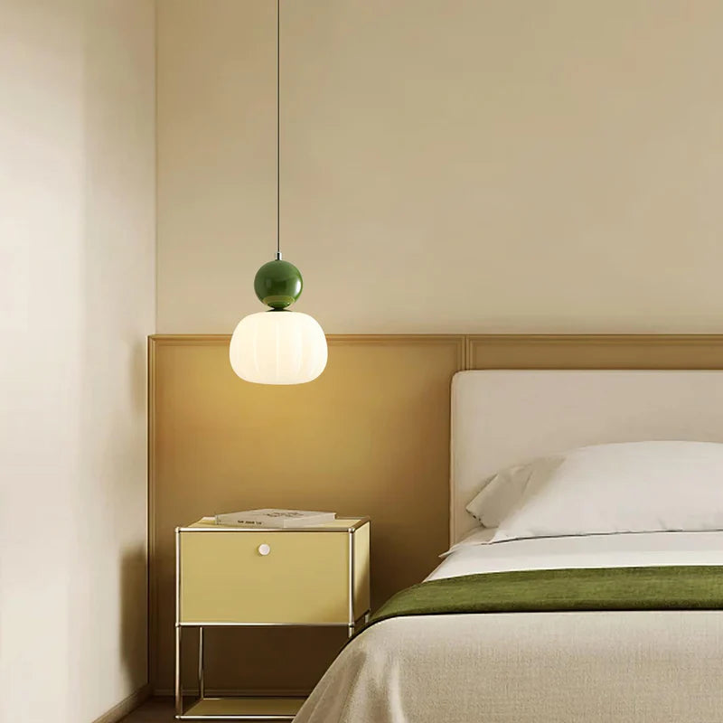 Modern Hailie pendant light over a bedroom bed