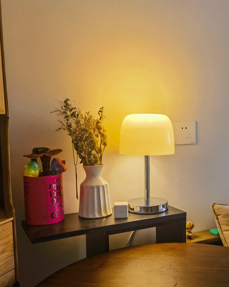 RANGU designer table lamp shown on a bedside table in a modern bedroom — DecoHarmonie
