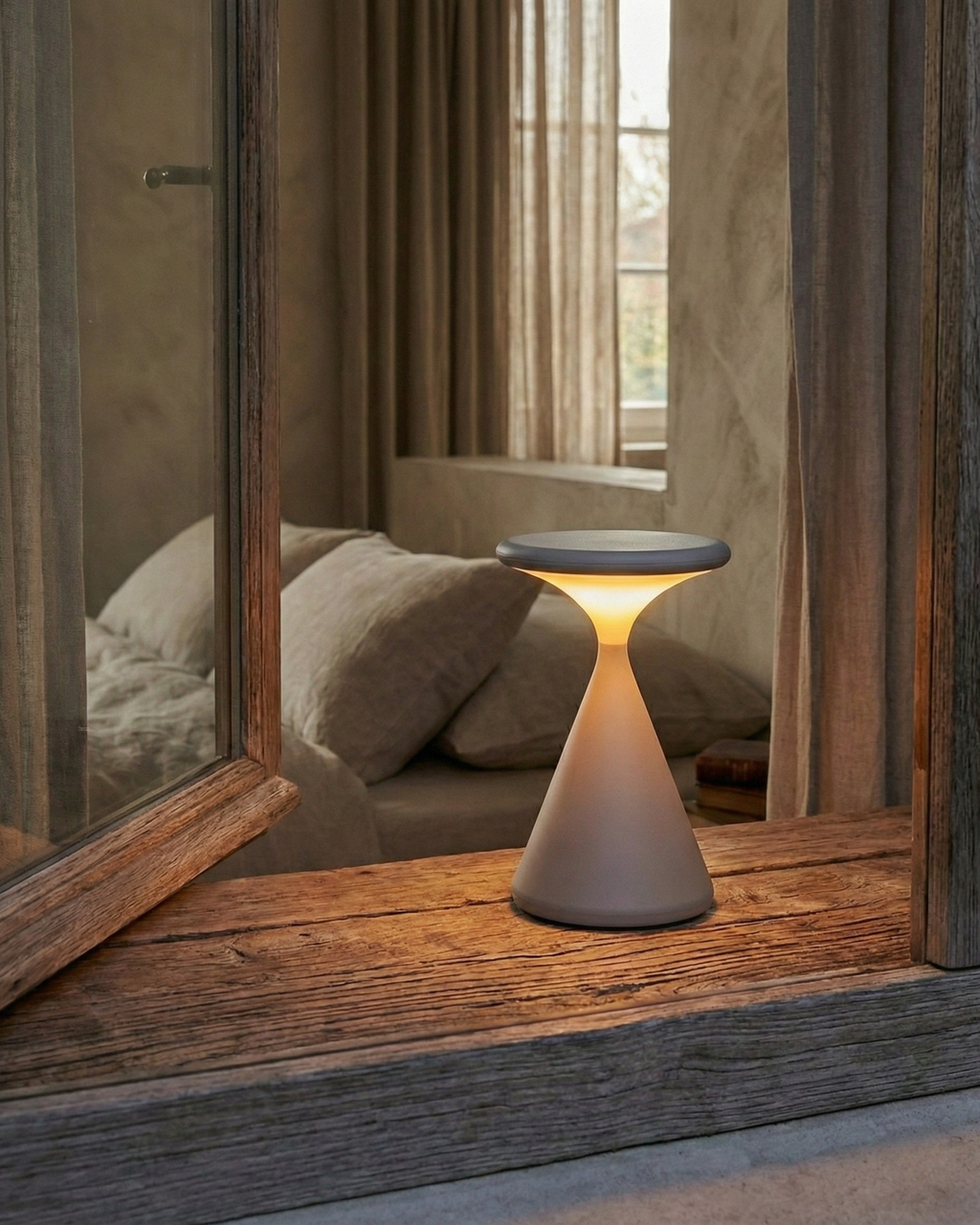 KONI cordless designer table lamp shown on a bedside table in a modern bedroom — DecoHarmonie