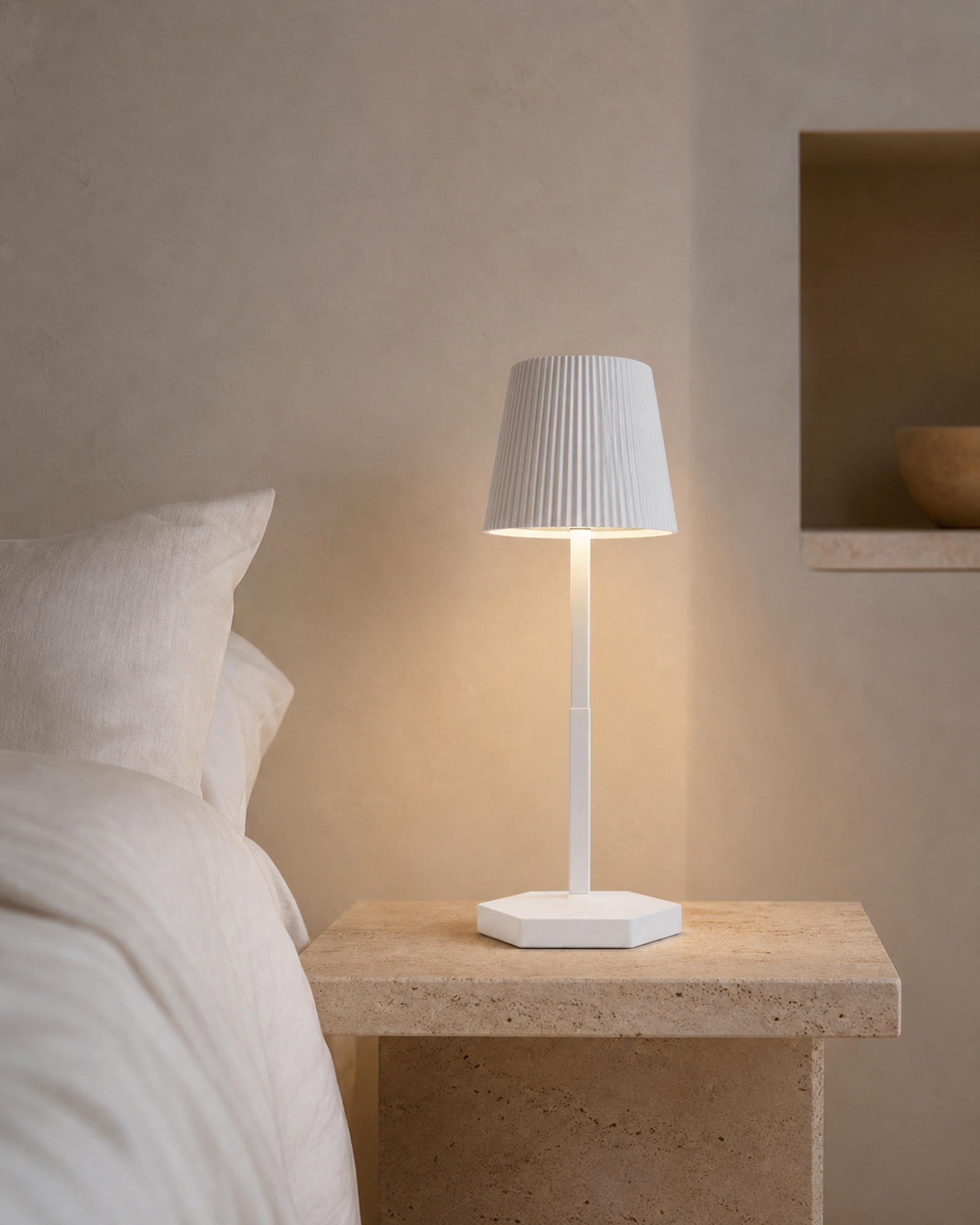 TOVI Cordless Table Lamp — Pleated Shade, Variable White LED — White, lifestyle view, travertine bedroom | DecoHarmonie