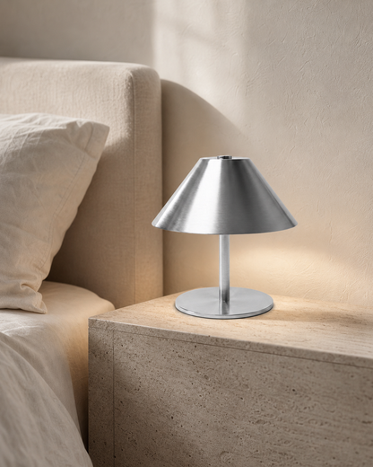 VARMA Cordless Mushroom Table Lamp — Angular Metal, Touch Control — Silver, lifestyle view, travertine bedroom | DecoHarmonie