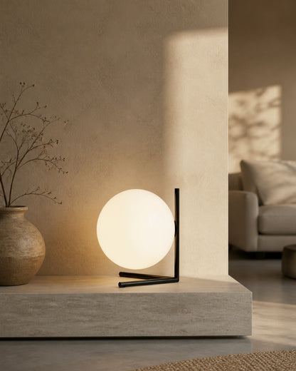 KAEN Designer Table Lamp — Slim Metal Frame, Luminous Glass Globe — Black, living room lifestyle | DecoHarmonie