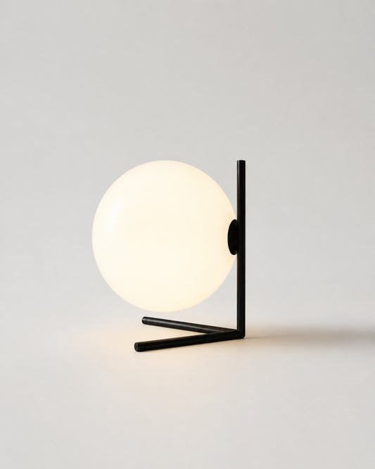 KAEN Designer Table Lamp — Slim Metal Frame, Luminous Glass Globe — Black, studio packshot on grey background | DecoHarmonie