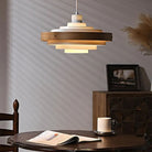 Modern pendant light over a dining table, wood and metal finish