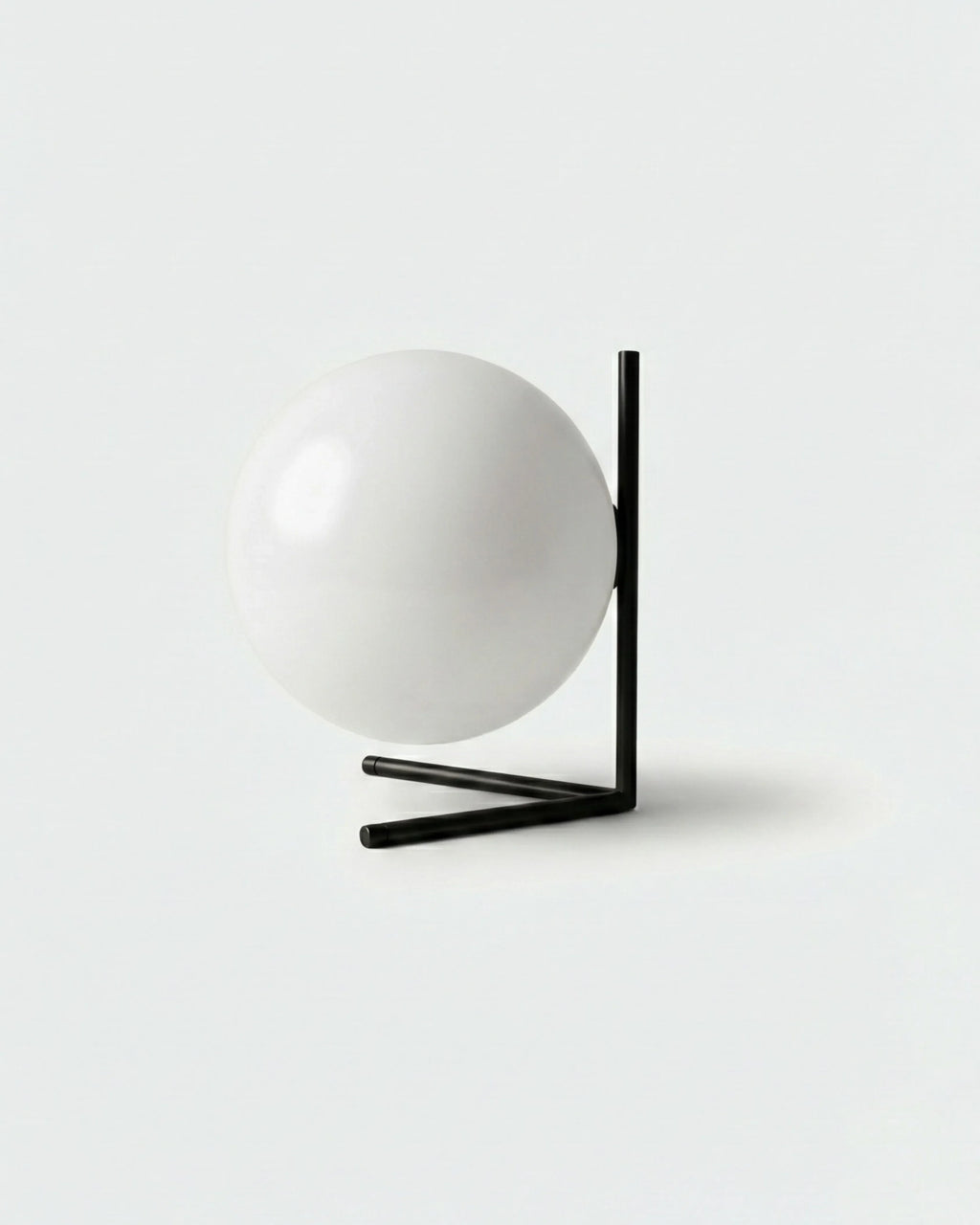 KAEN designer table lamp with white glass sphere cradled in angular black metal frame | DecoHarmonie