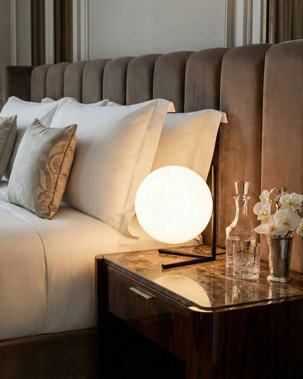 KAEN designer table lamp casting warm ambient light over a coffee table — DecoHarmonie