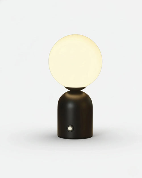 LUMI cordless table lamp with frosted glass globe shade on matte black metal base, rechargeable | DecoHarmonie