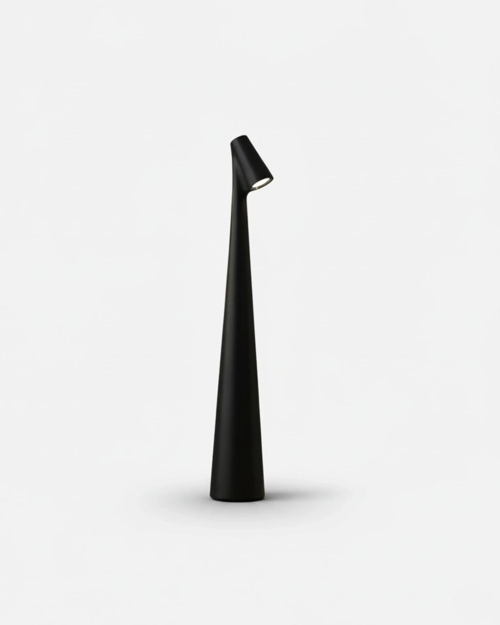 NORA cordless table lamp, sculptural matte black tapered tower with angled spotlight head, rechargeable designer | DecoHarmonie
