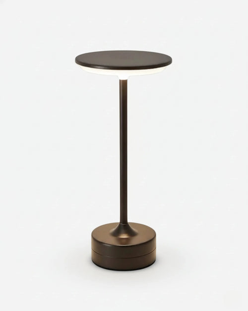 LORA cordless table lamp with slim bronze metal stem and round flat disc top, rechargeable design | DecoHarmonie