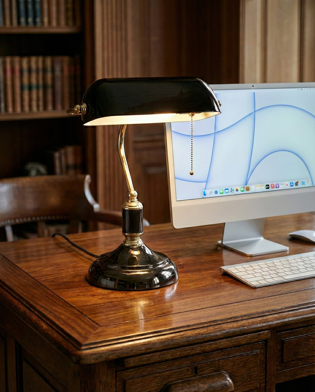 ANTIK banker's designer desk lamp in a warm, considered living room setting — DecoHarmonie