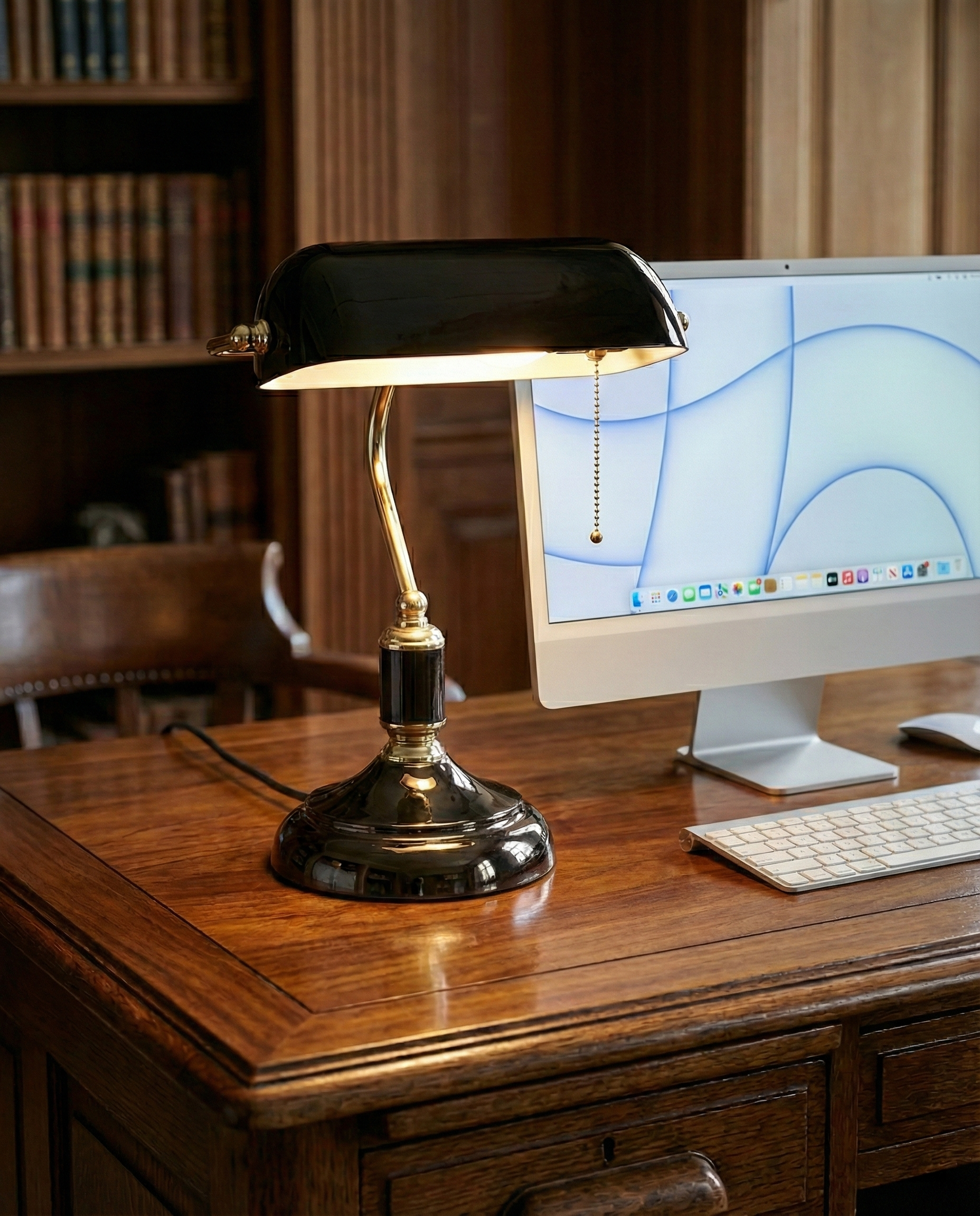 ANTIK banker's designer desk lamp in a warm, considered living room setting — DecoHarmonie